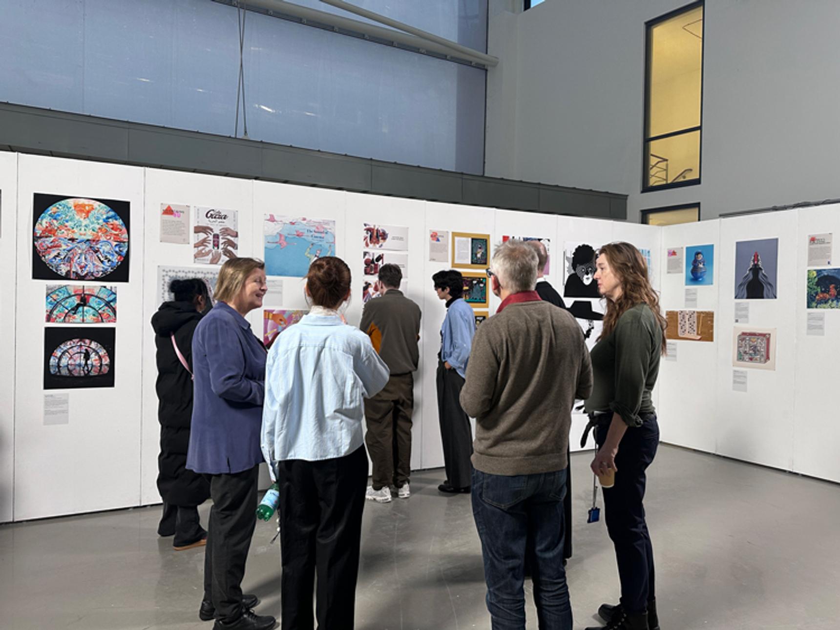 A group of adults at an art exhibition