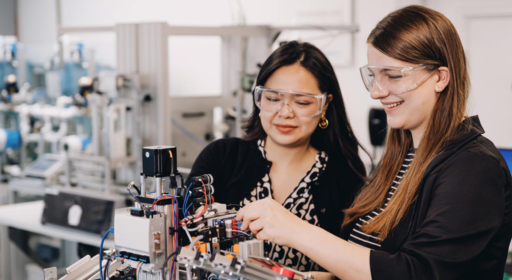 Two female students working in a mechatronics lab at Middlesex University