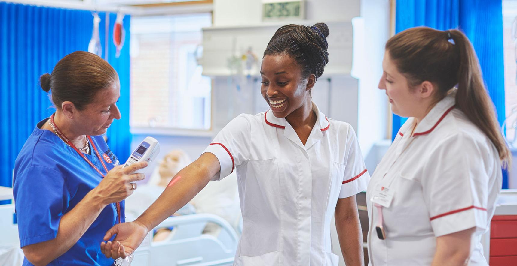 Students working in midwifery ward.