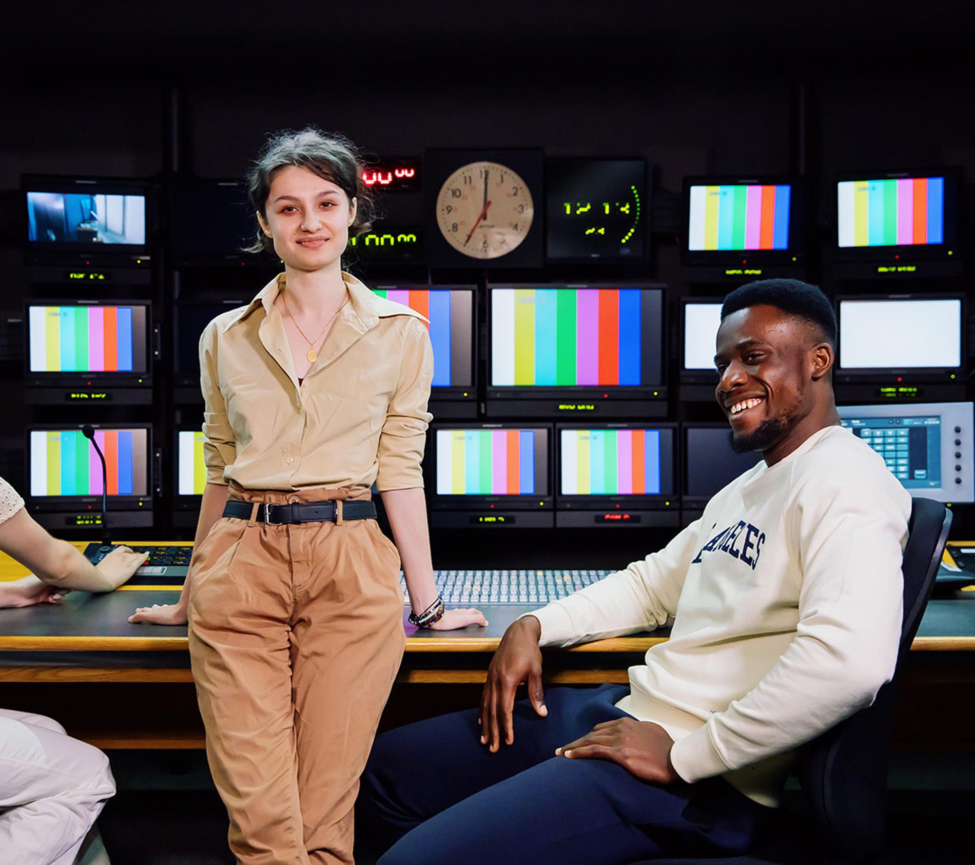Male and female students in live television studio