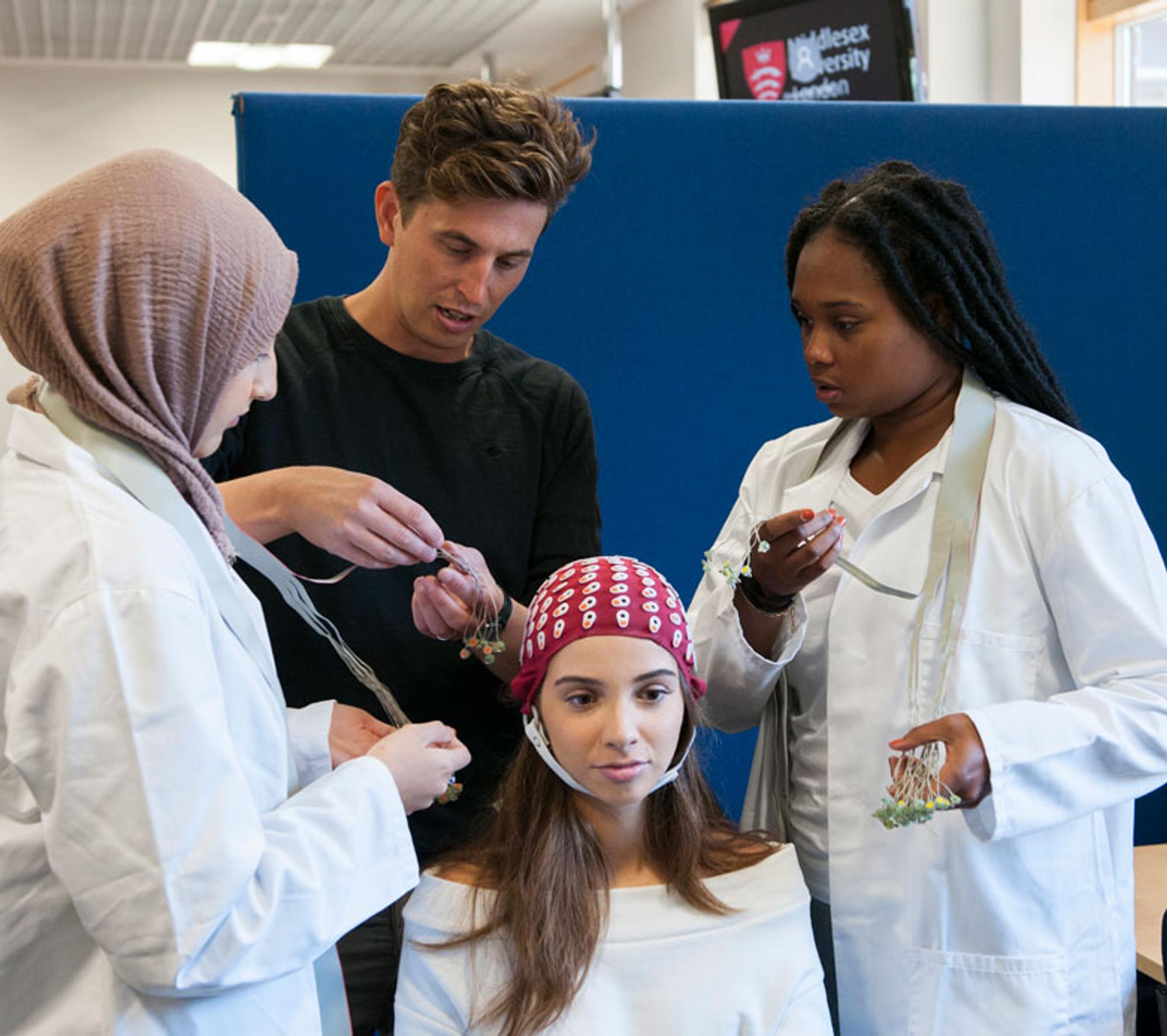 Group of Psychology students examine a patient
