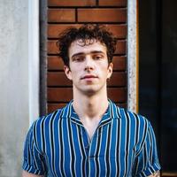 Student in blue and white striped shirt