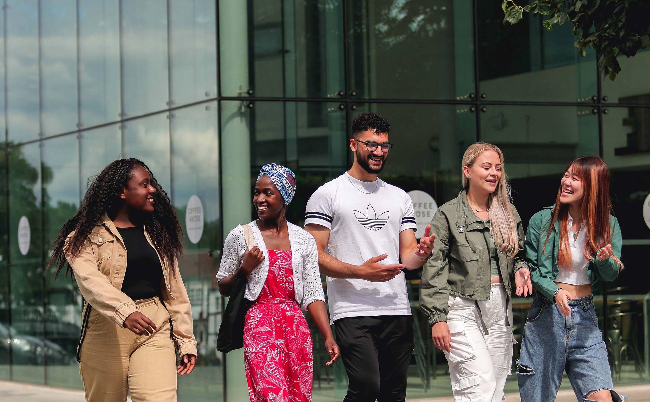 Group of students walking through campus