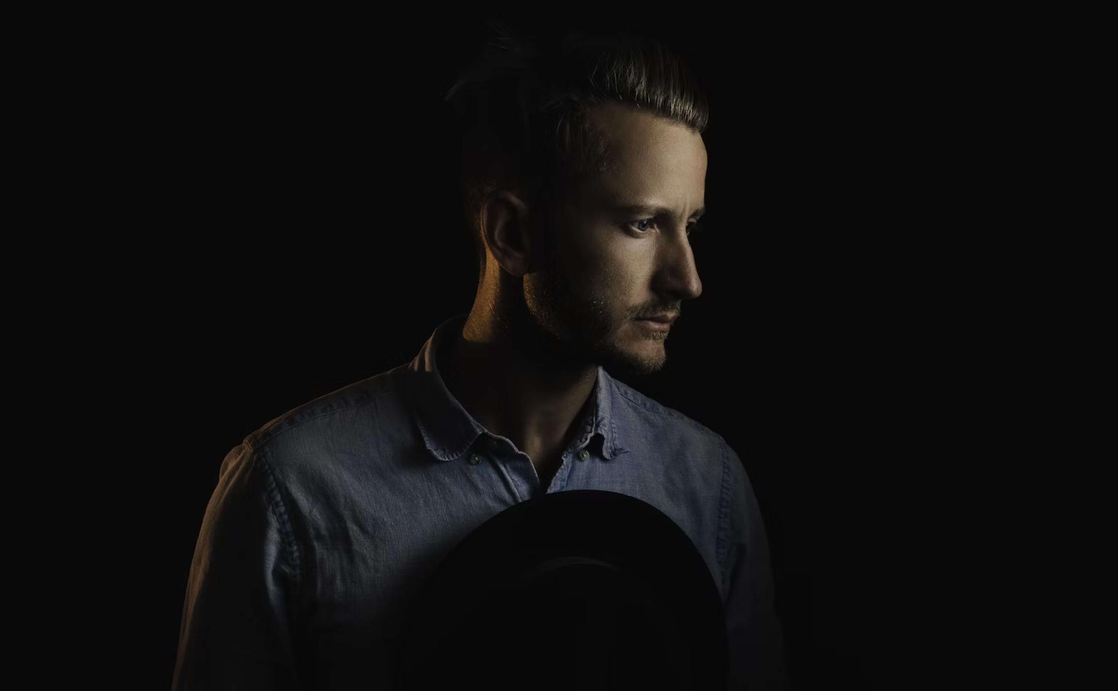 Person in darkened lighting
