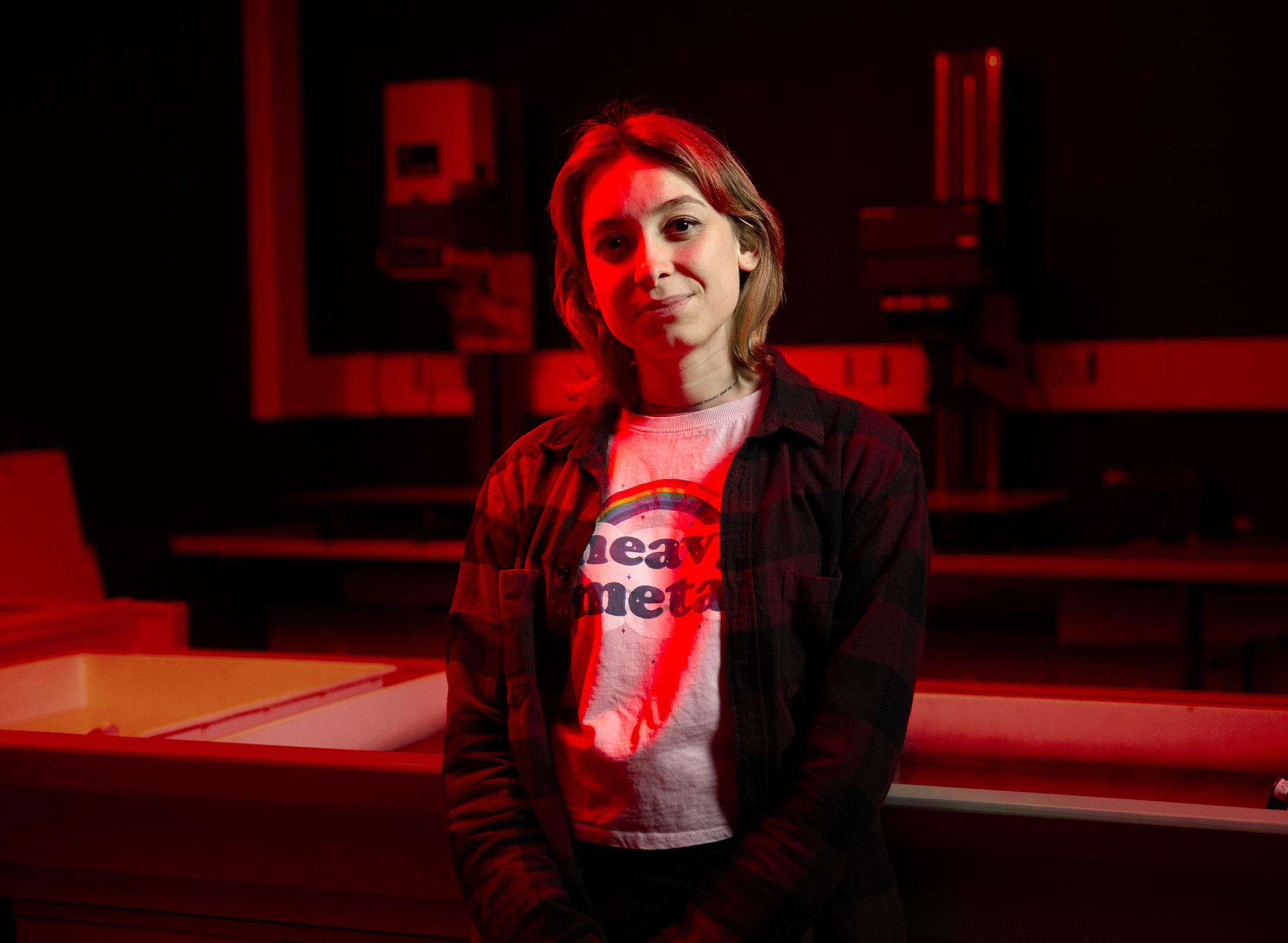 Female student in photography dark room