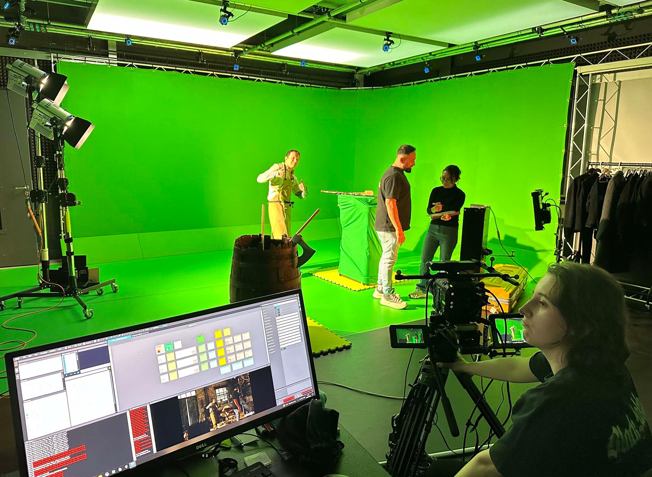 Students filming using green screen technology