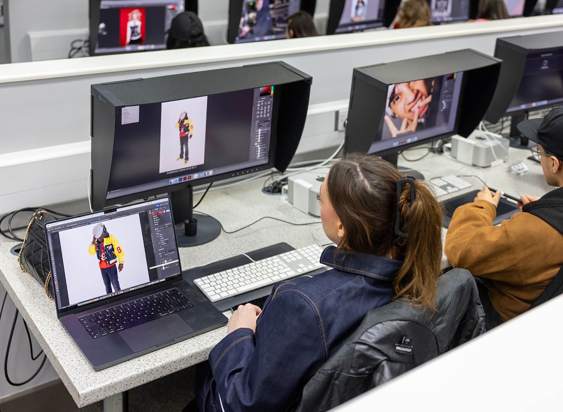 Students editing images on computer