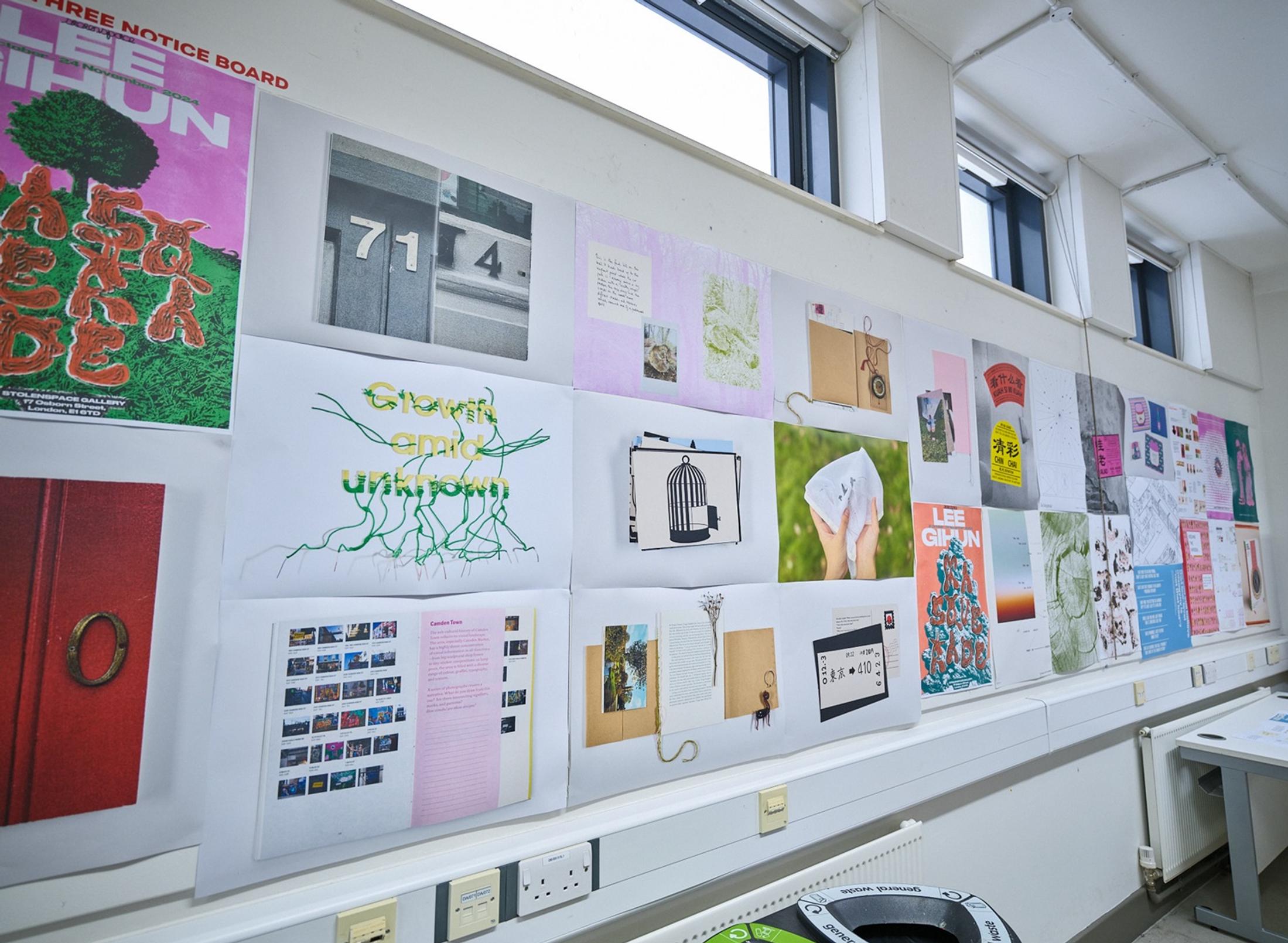 Two students in a computer lab, working on computers
