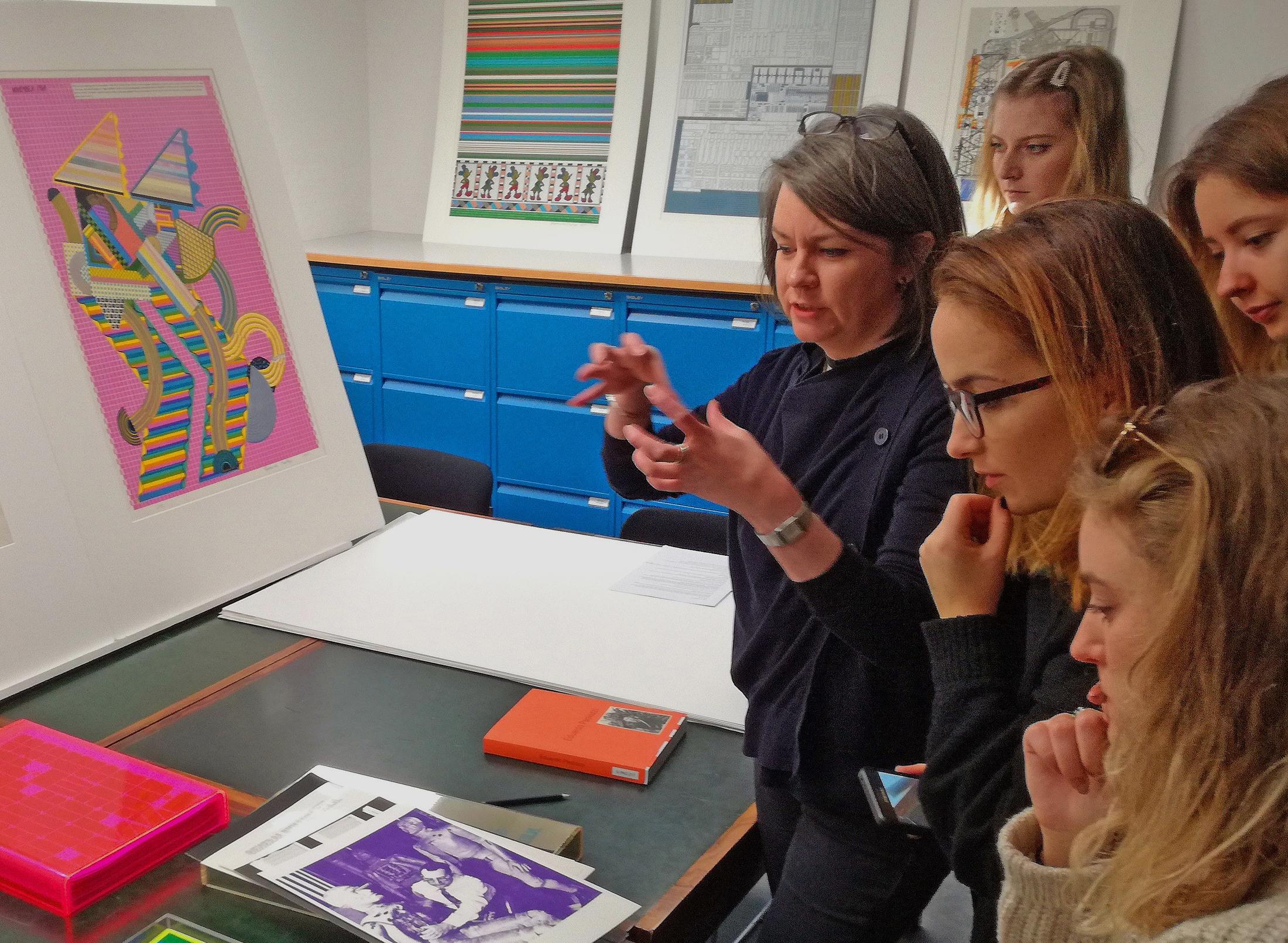 students and teachers in a graphic design studio