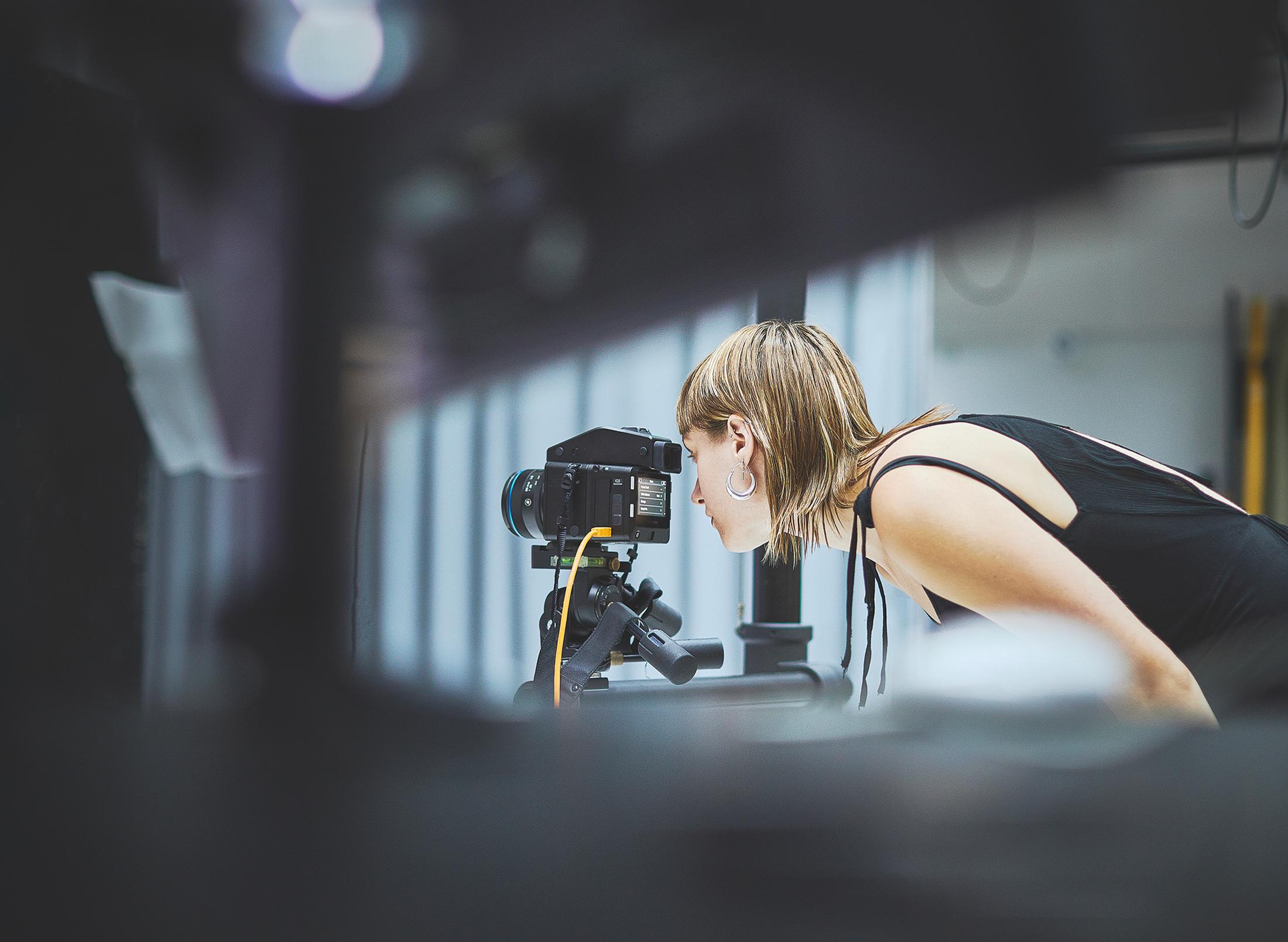 Student looking into camera in studio