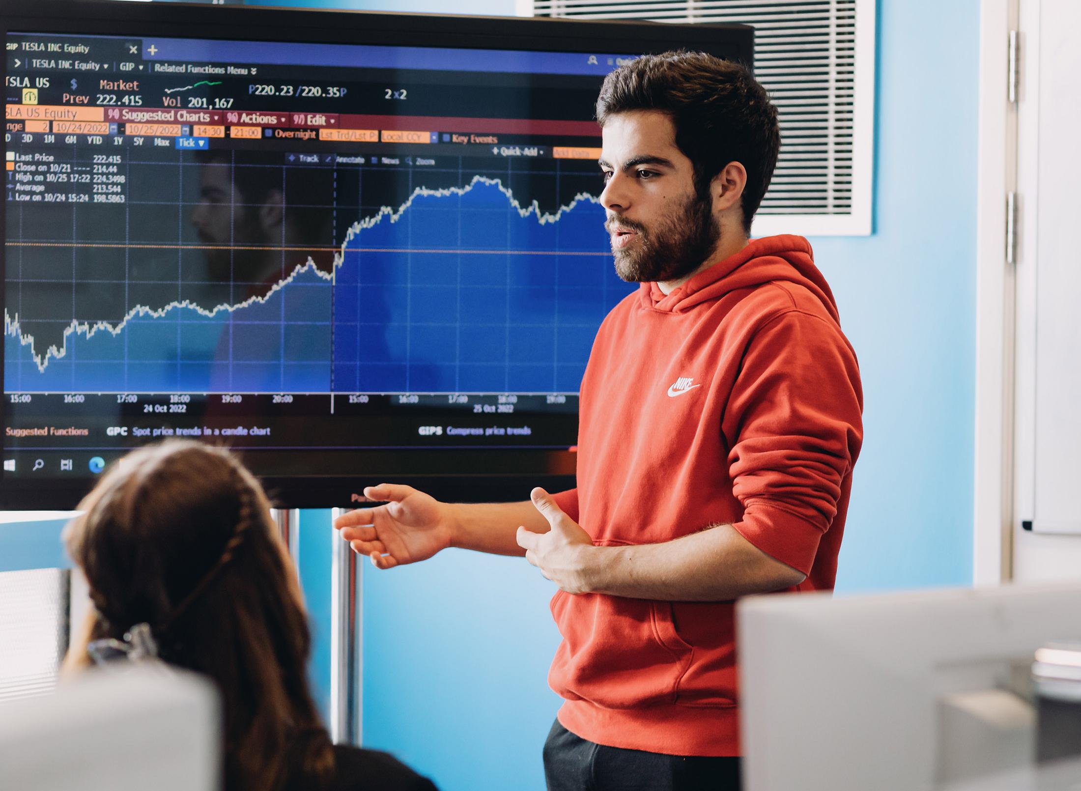 A student presenting financial data