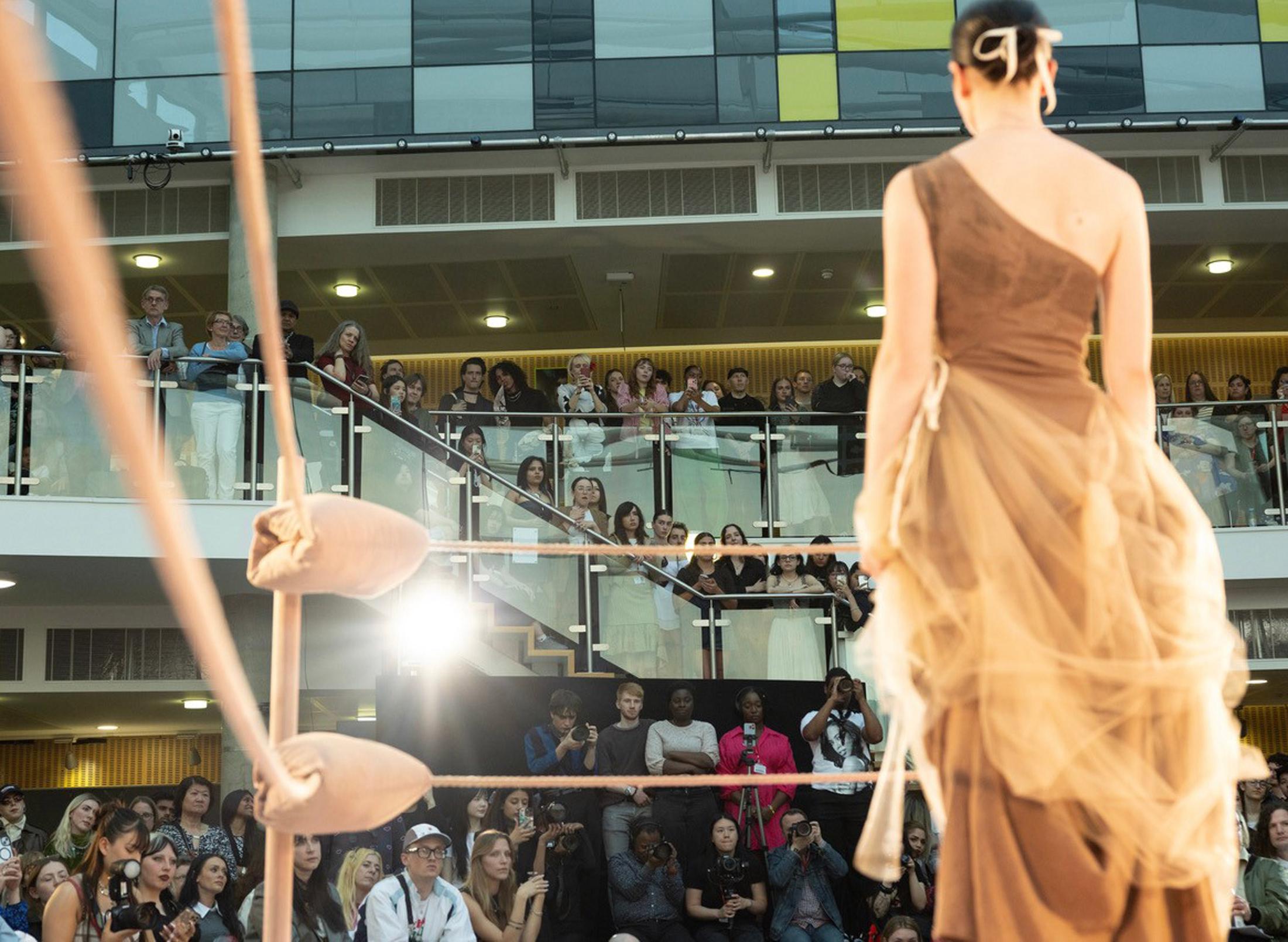Student model on a fashion show runway