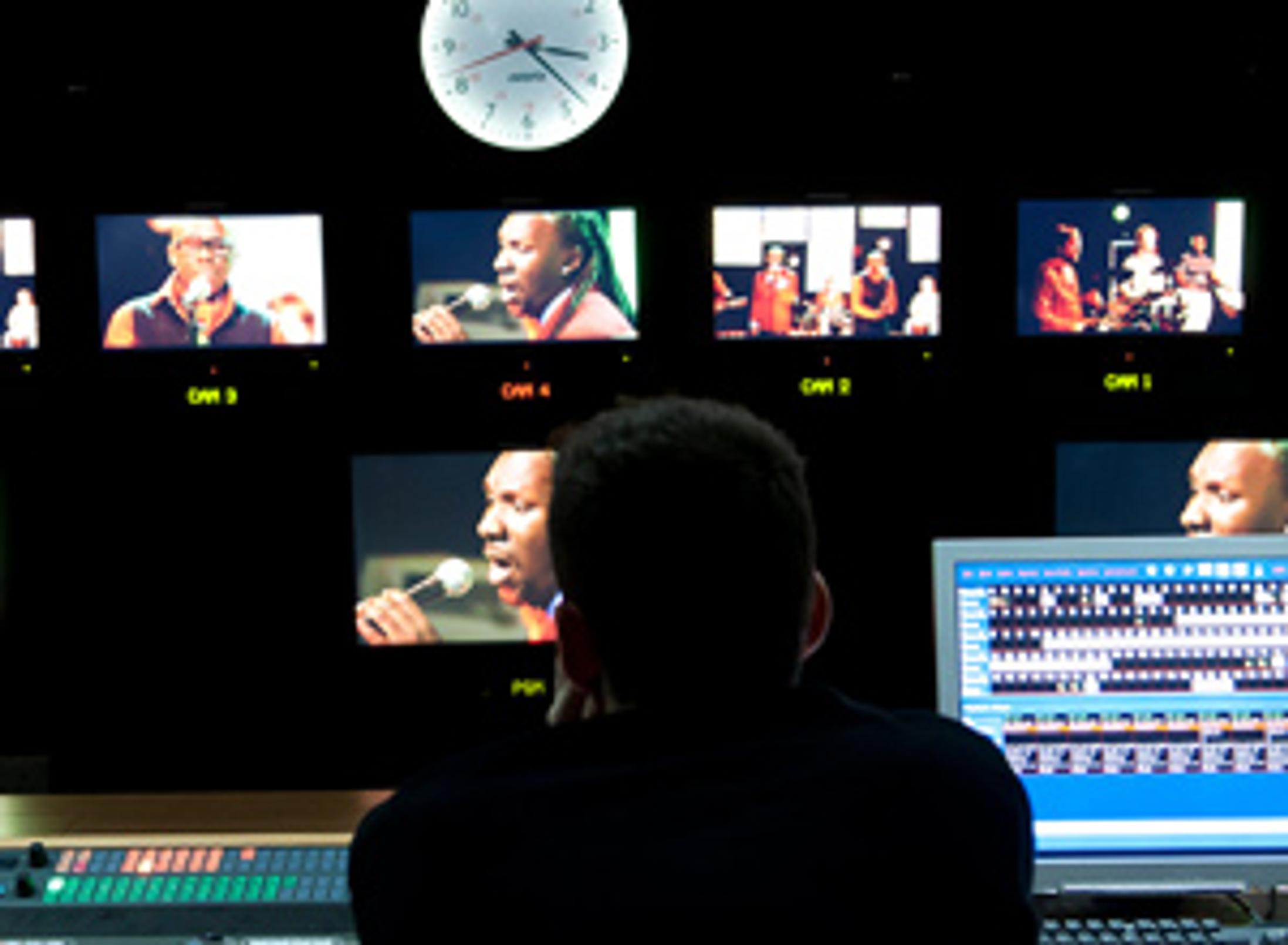 TV studio production setting with cameras showing multiple angles of a filming environment