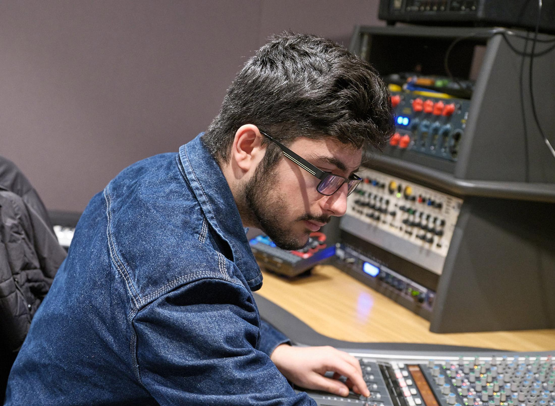 Student using a sound mixer