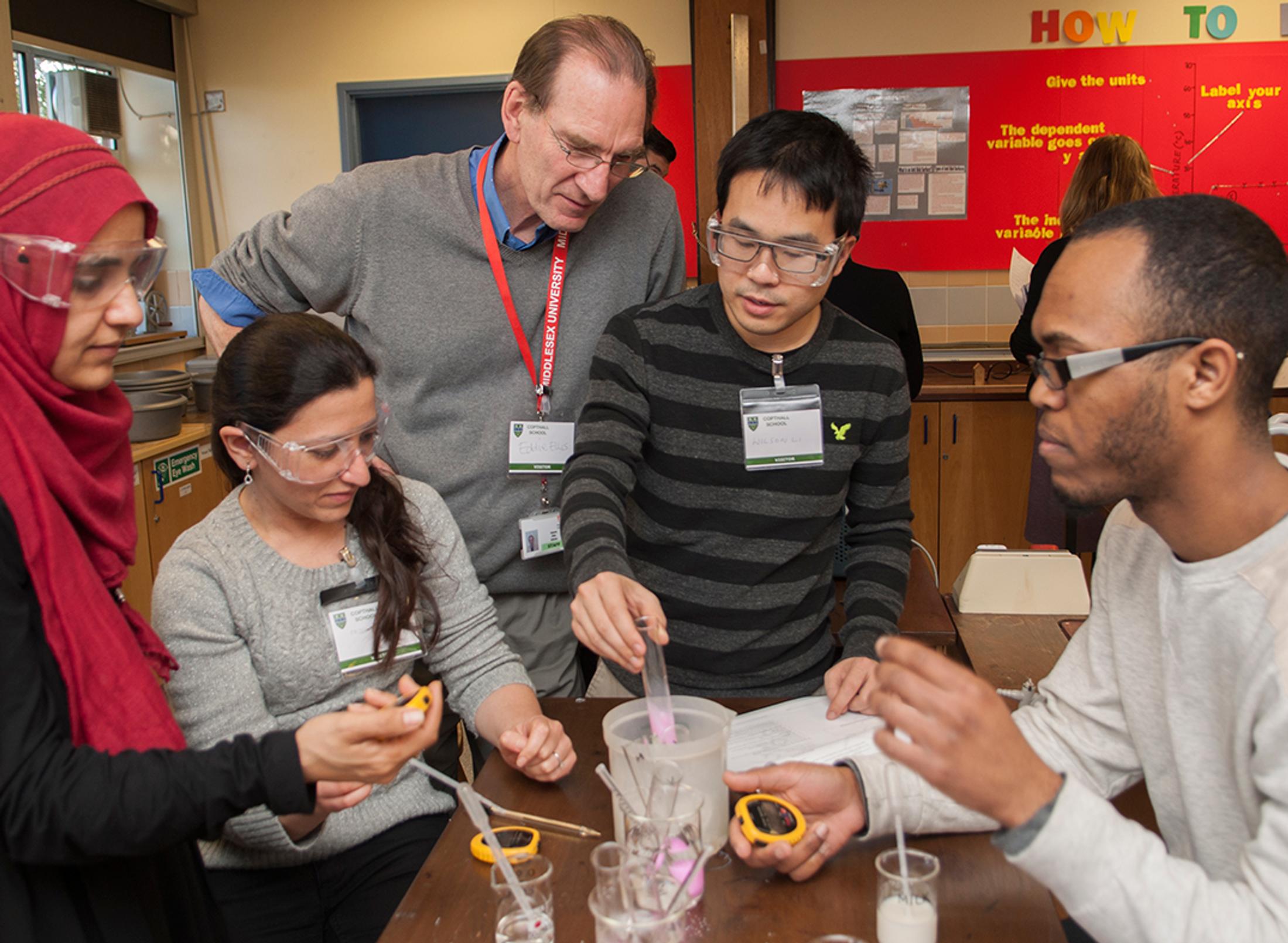 A lecturer and students in a lab