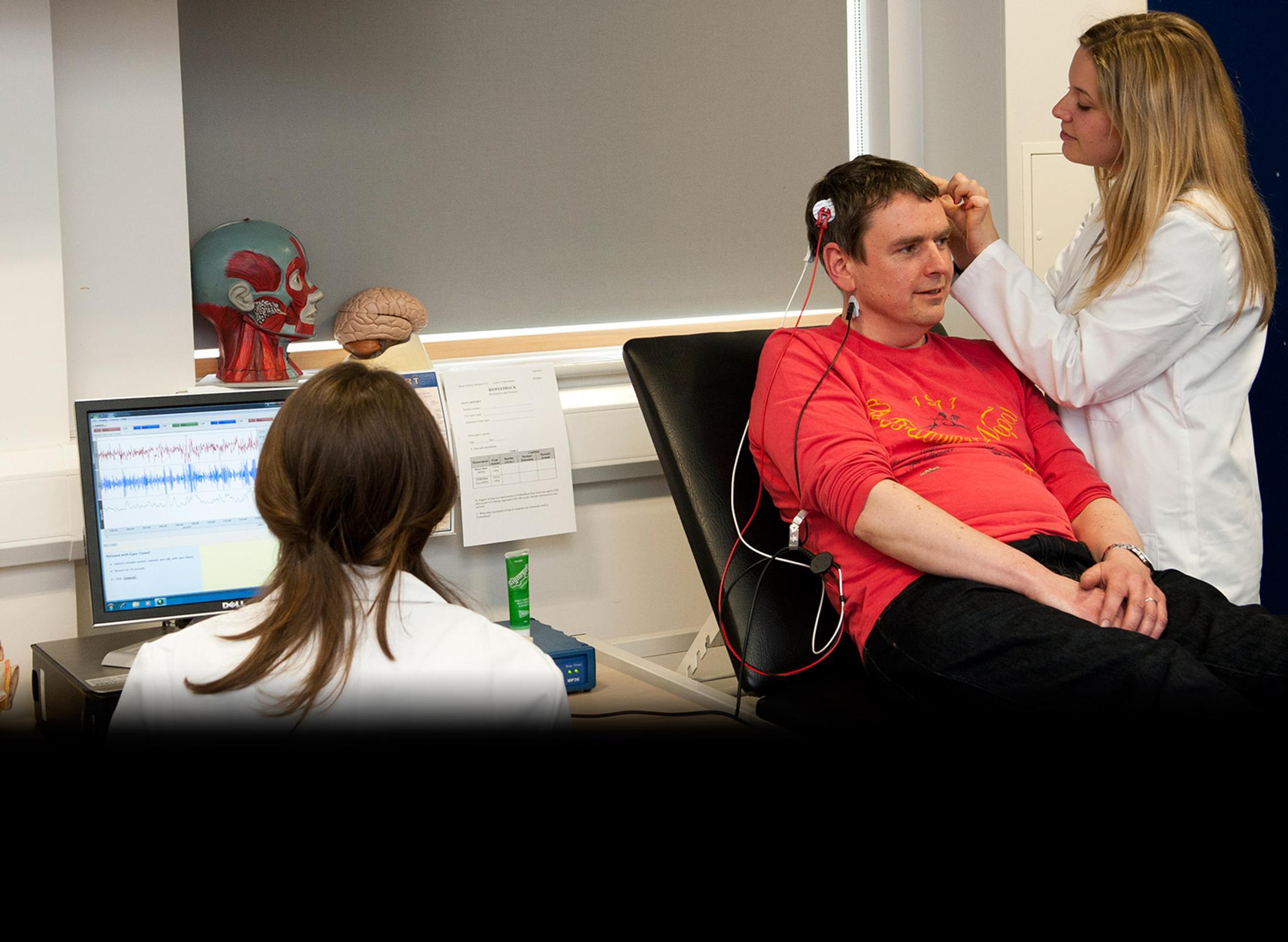 student doctor examining a patient's mind