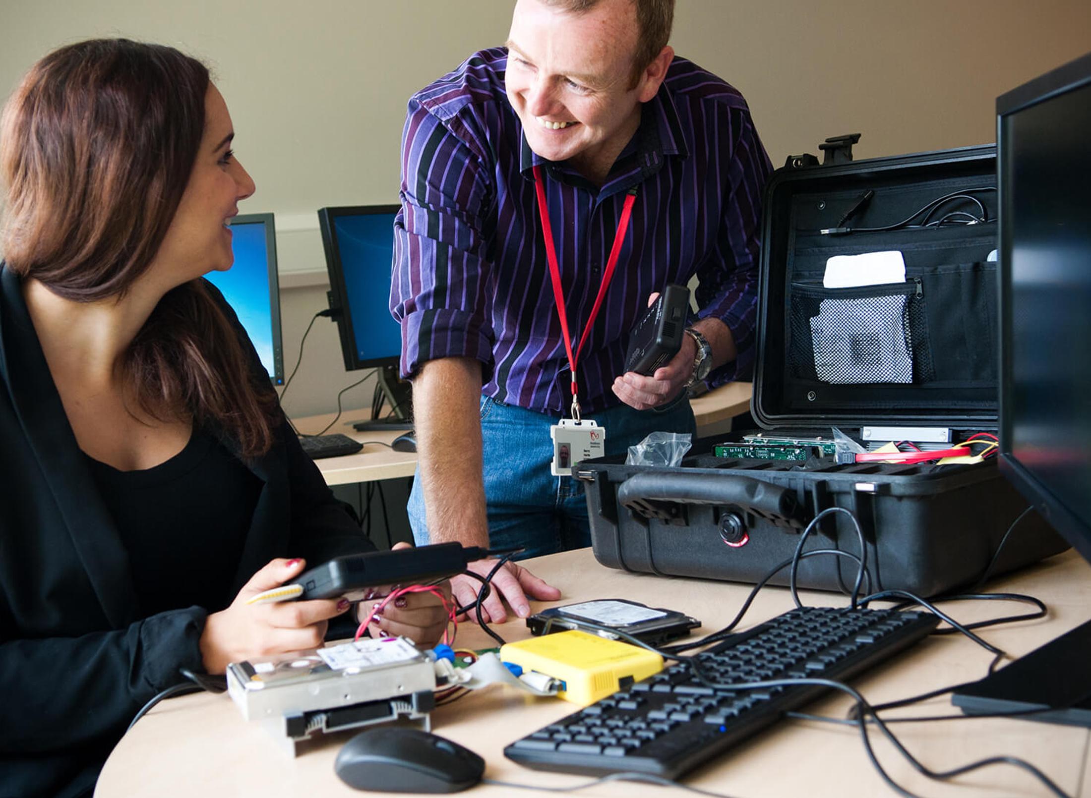 Student working with lecturer on computer
