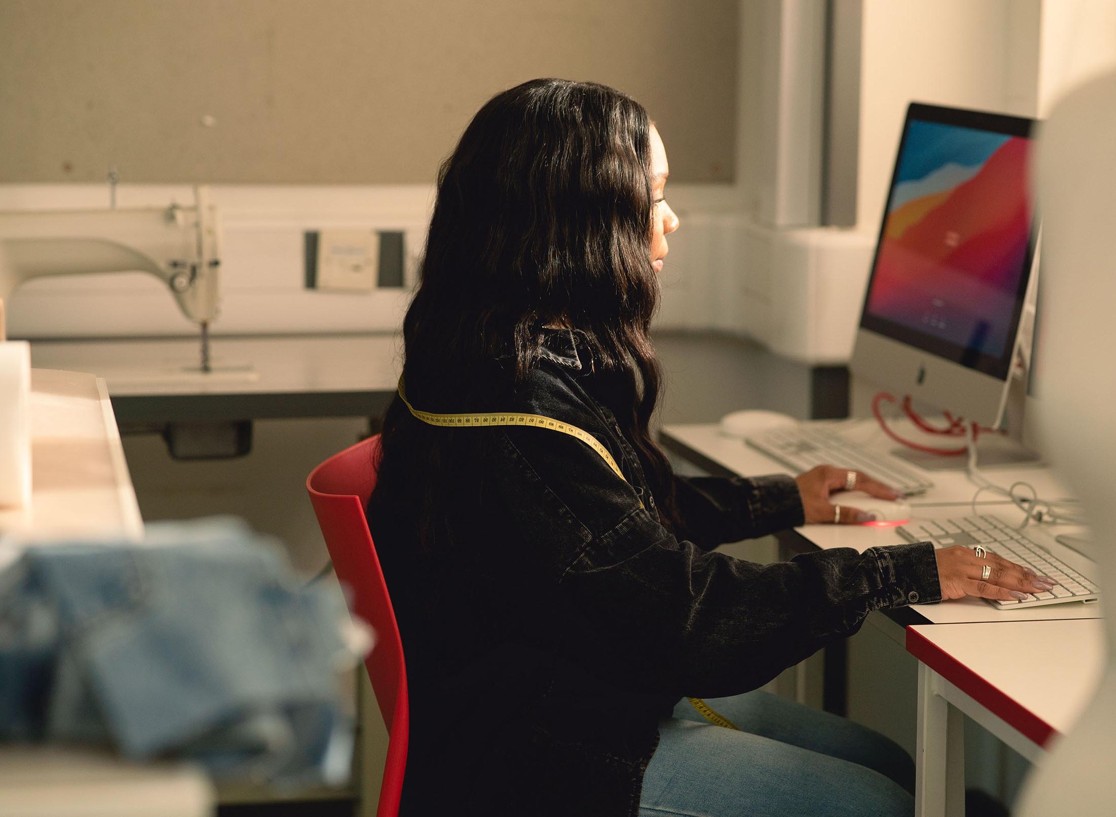 woman working at large computer