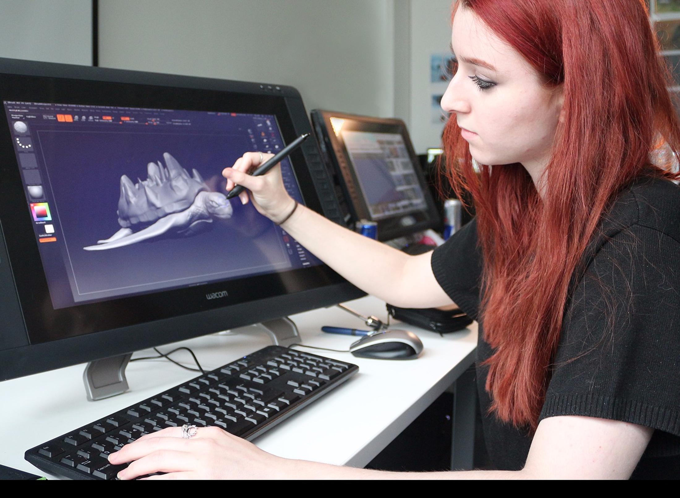 Student using  pen and 3D animation software on screen