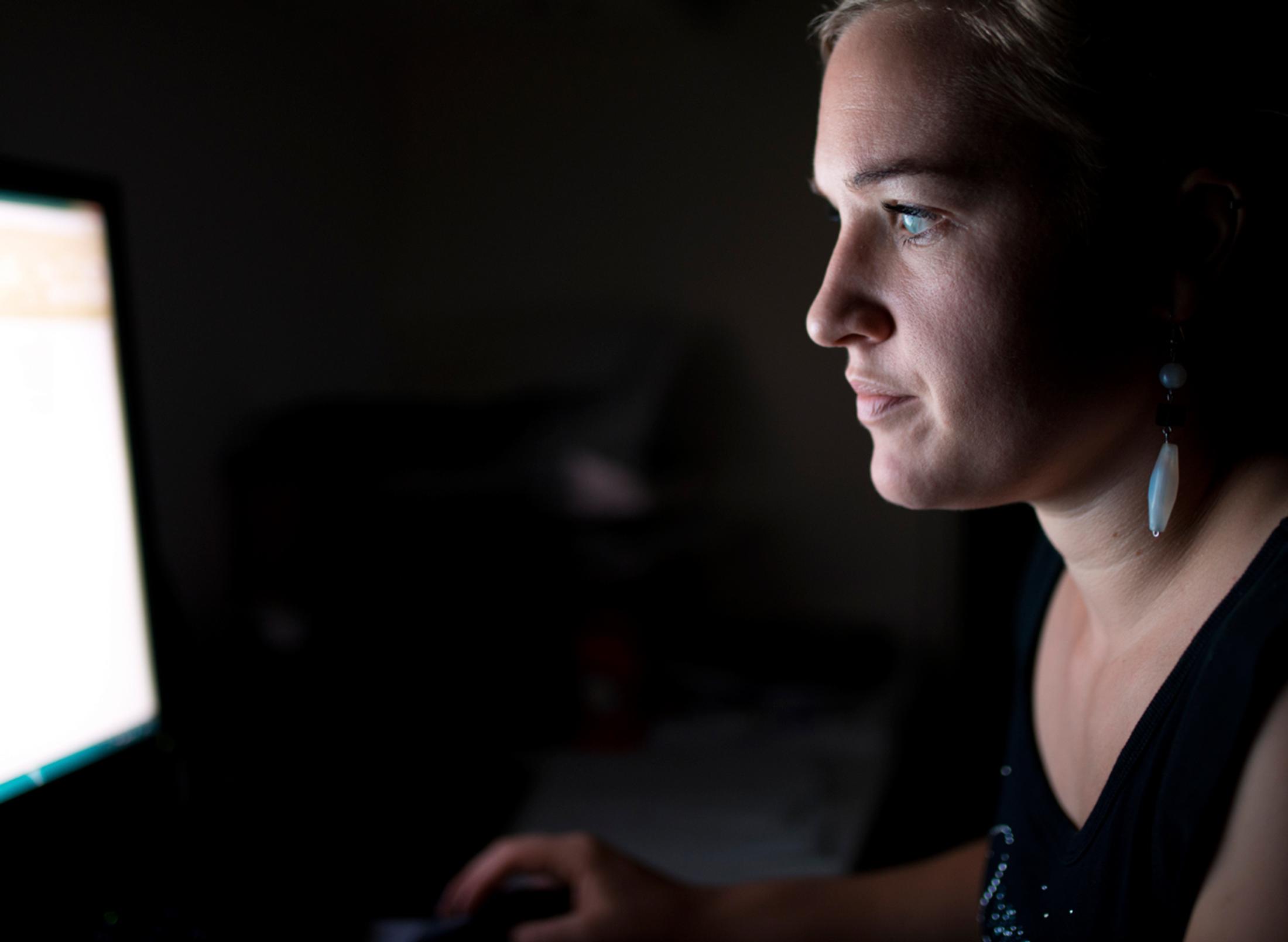 woman reading something from a computer screen