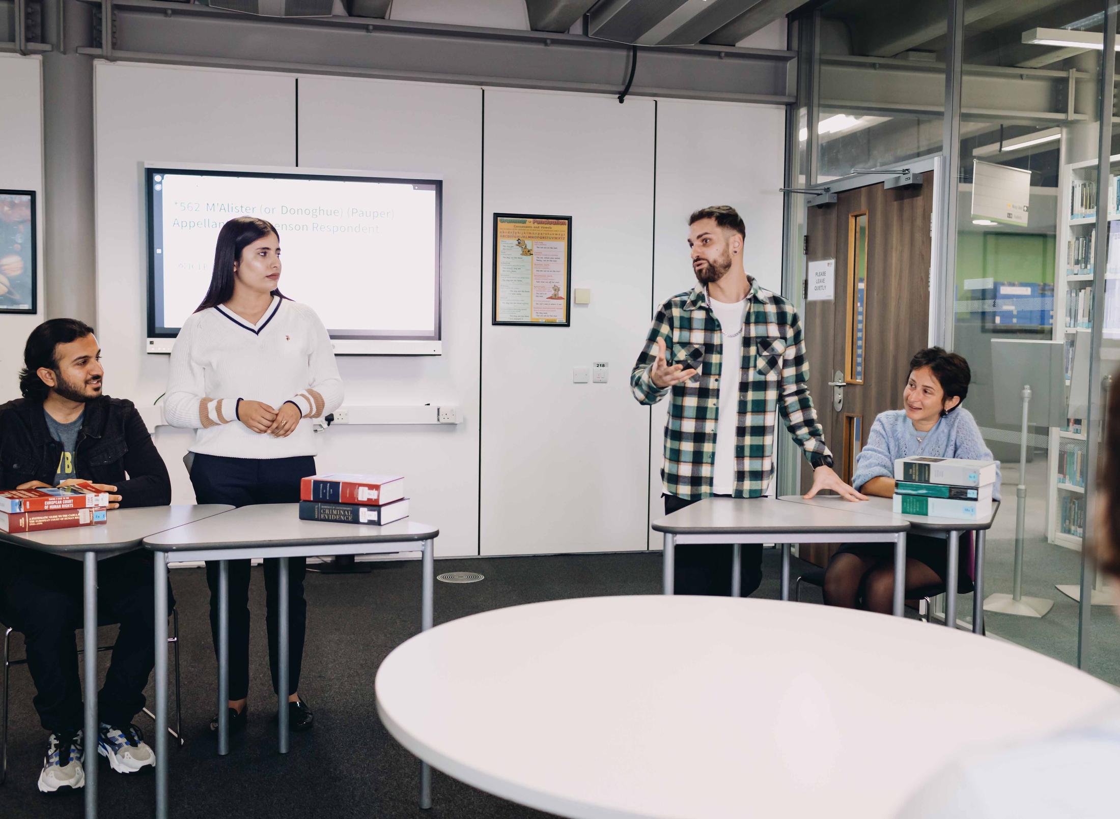 Students debating in a study room