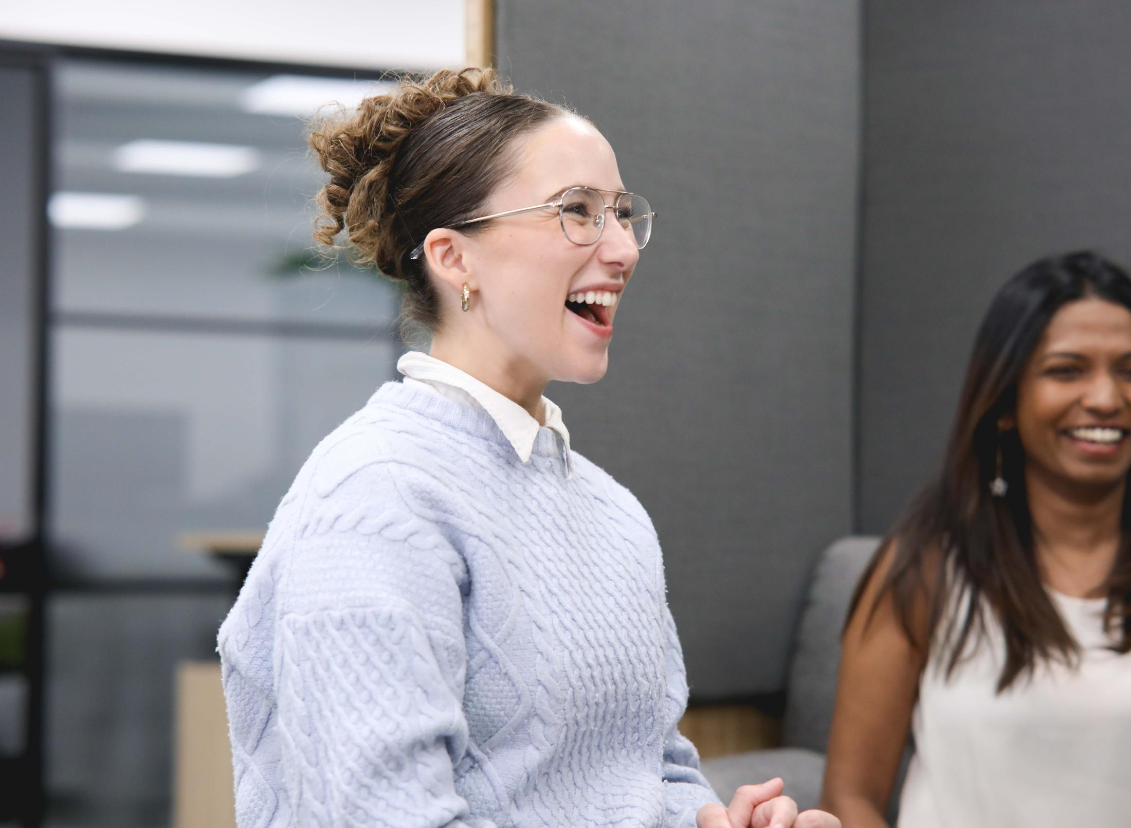 Two smiling female members of staff