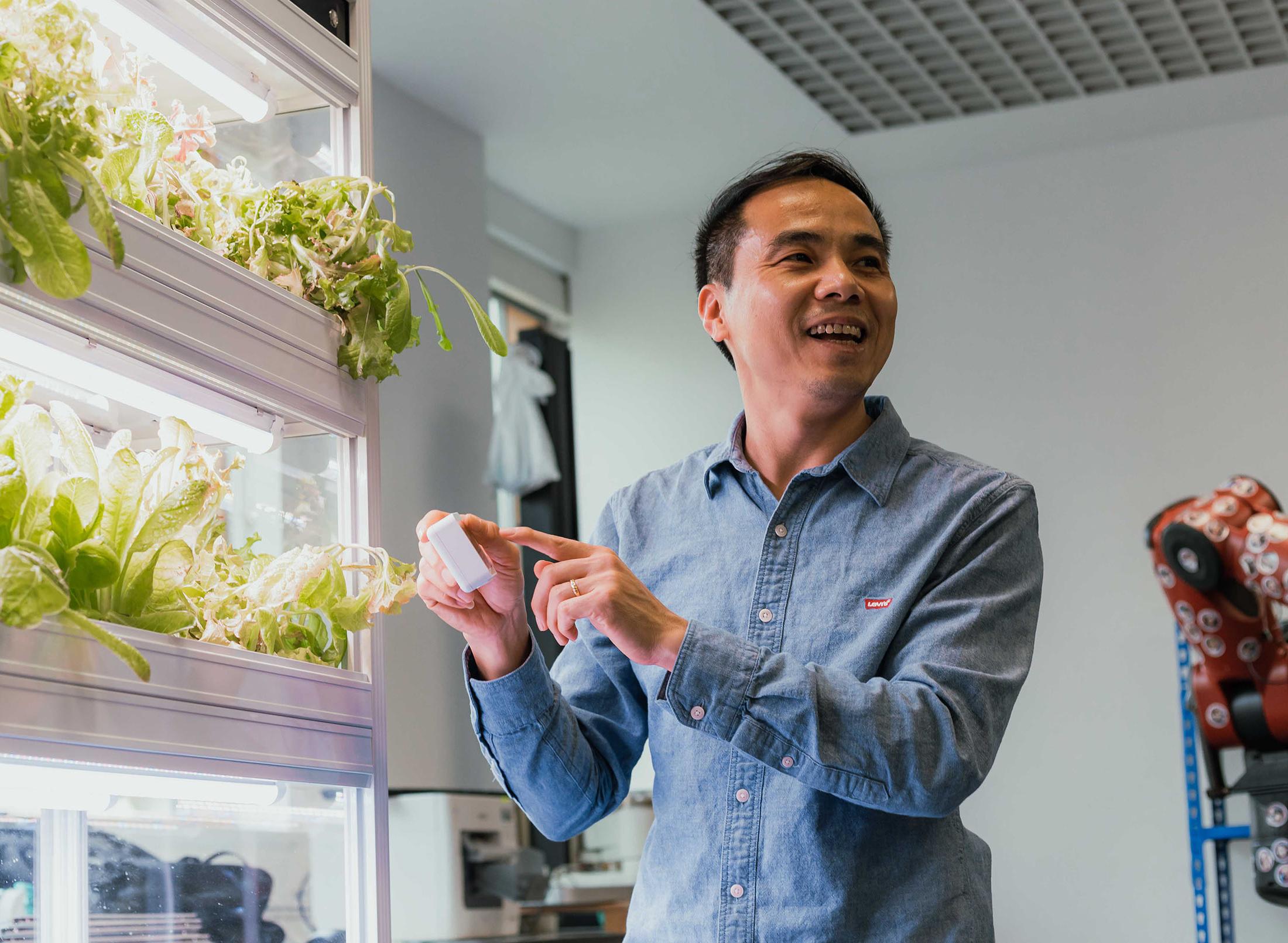 academic gesturing towards plants growning lab