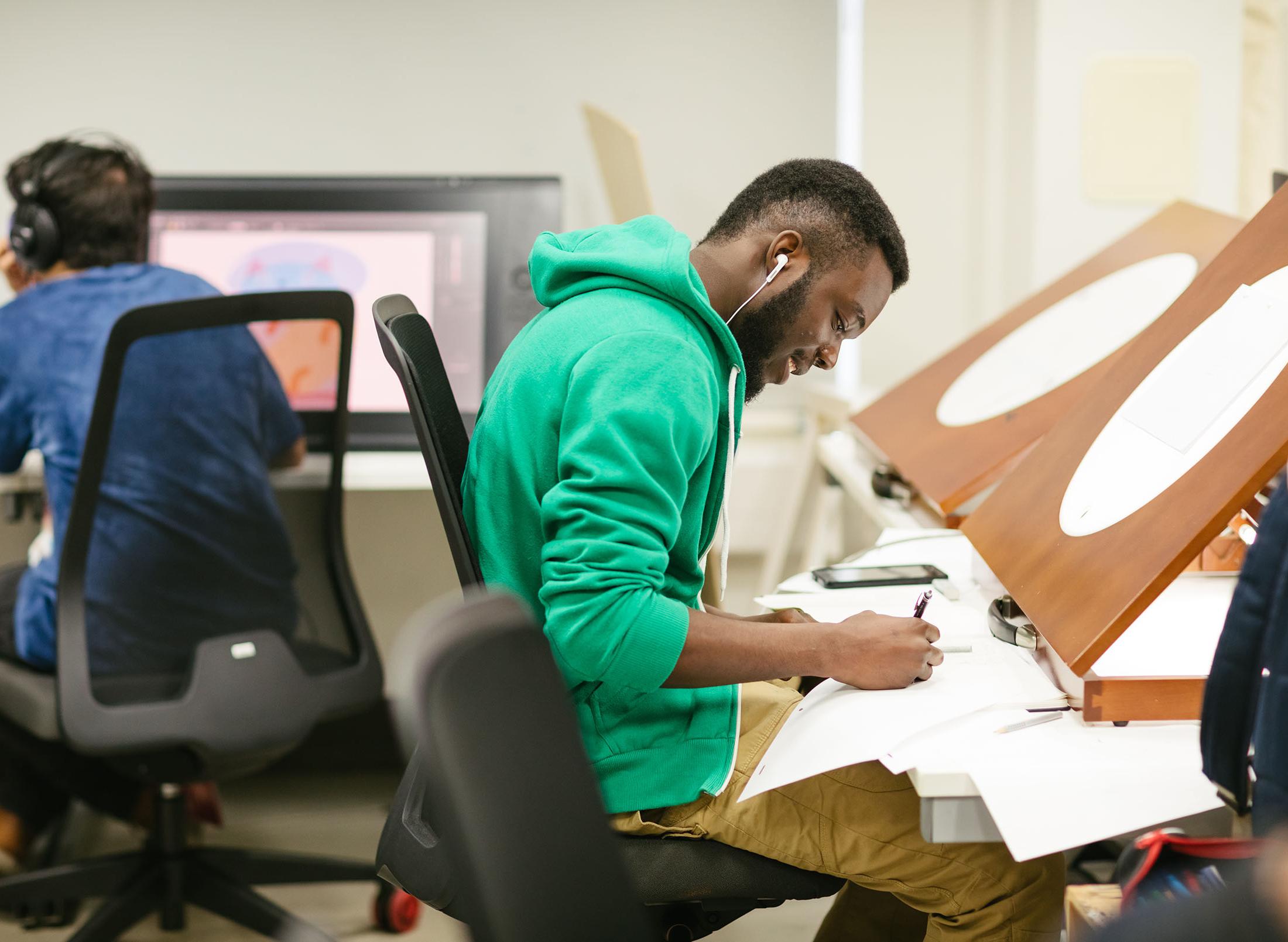 student works at drawing desk
