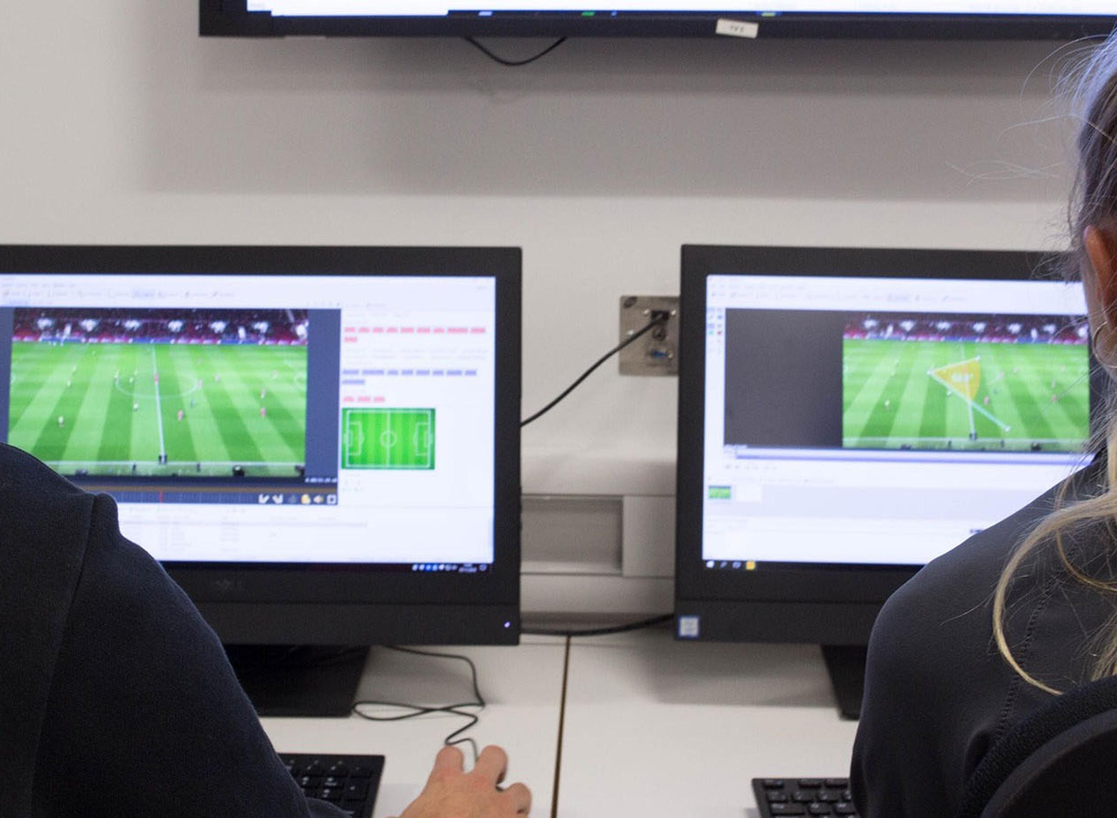 students analysing sports performances on a computer