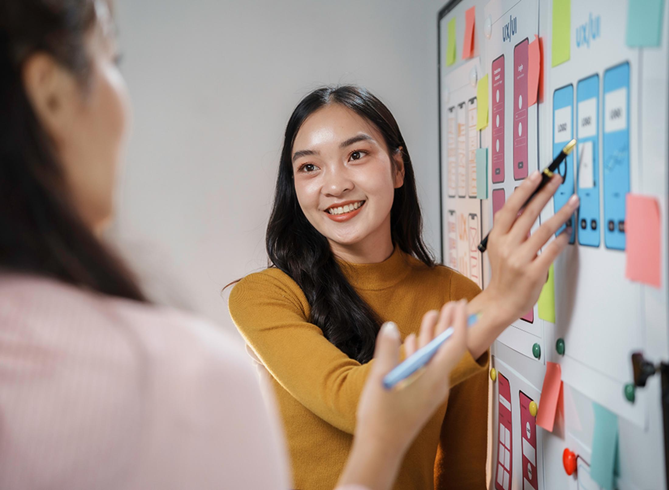 A student visually explaining something to another student