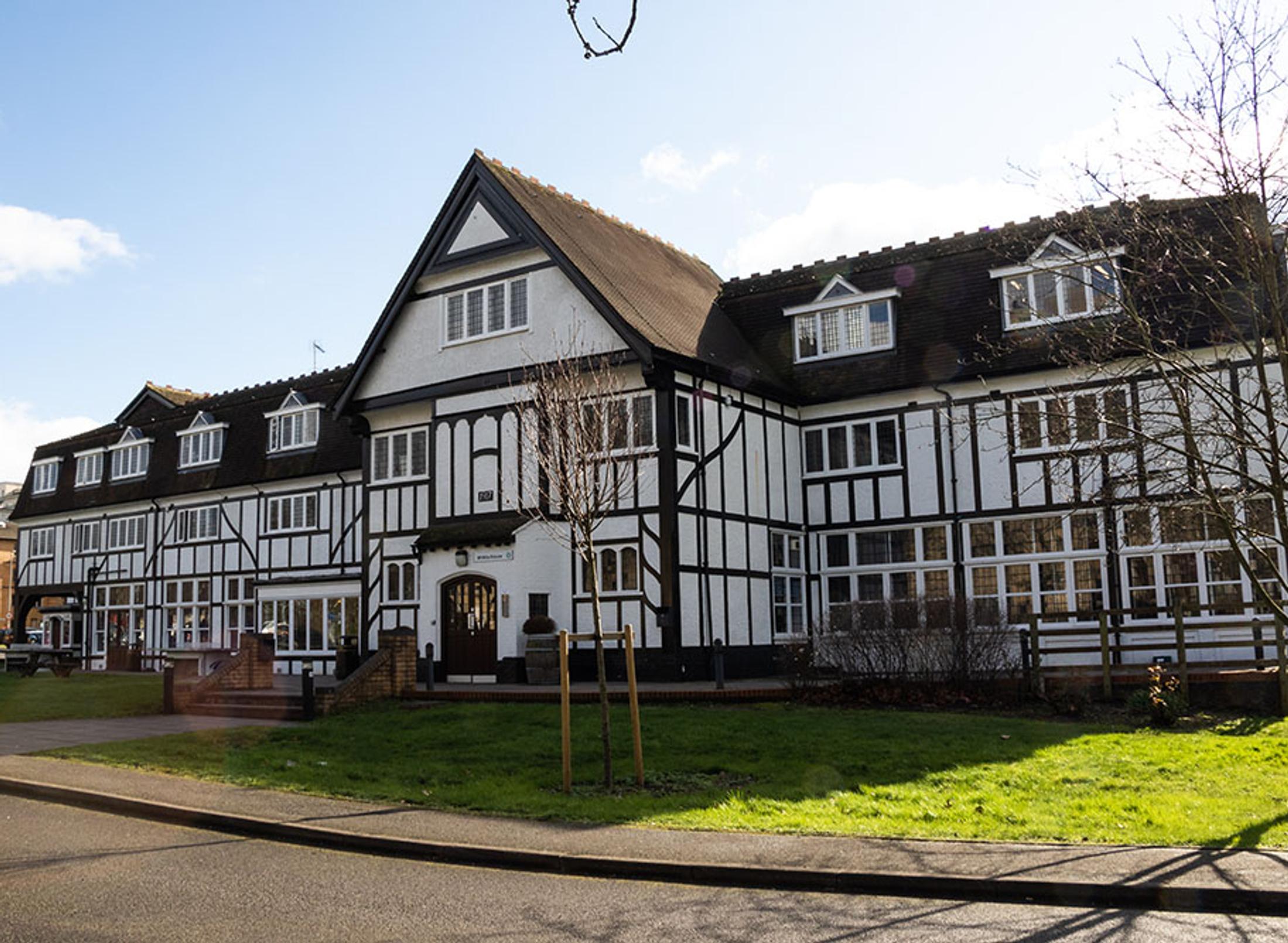 old white building with timbers
