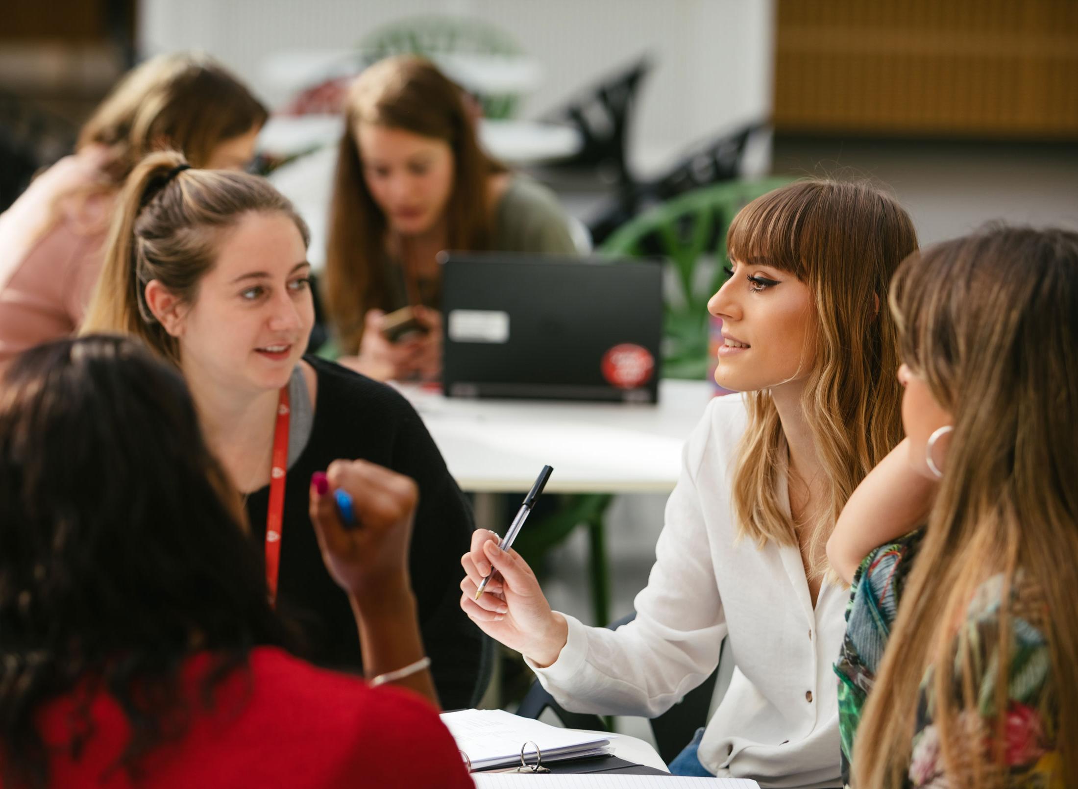 Staff and students chatting