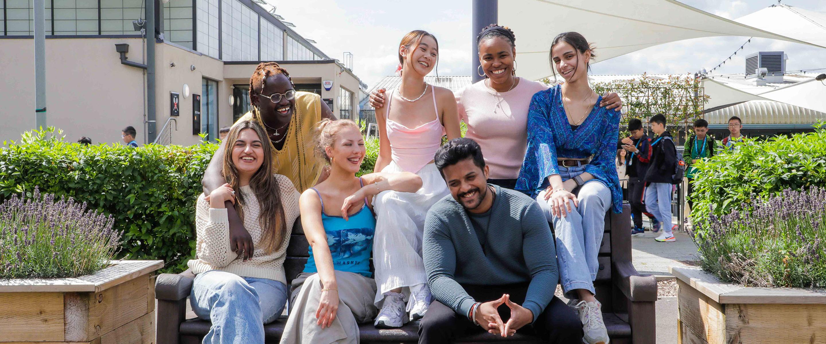 Group of students sat together on campus