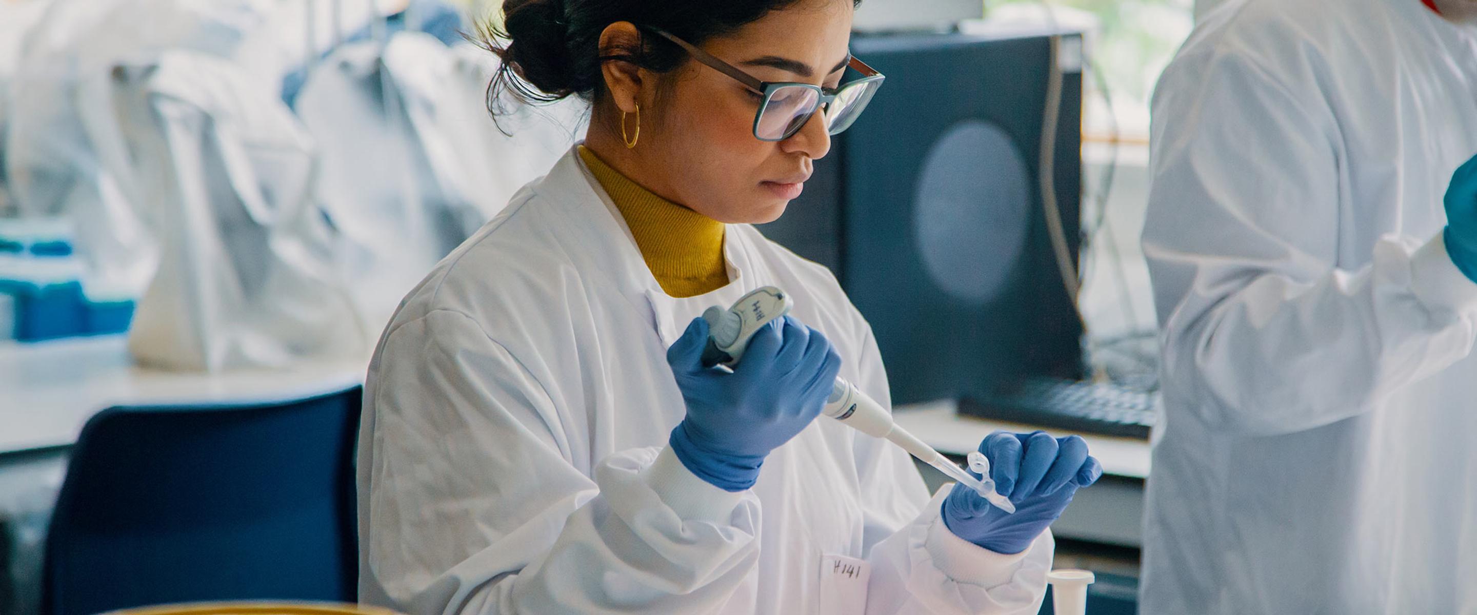 Biosciences student testing in on campus lab