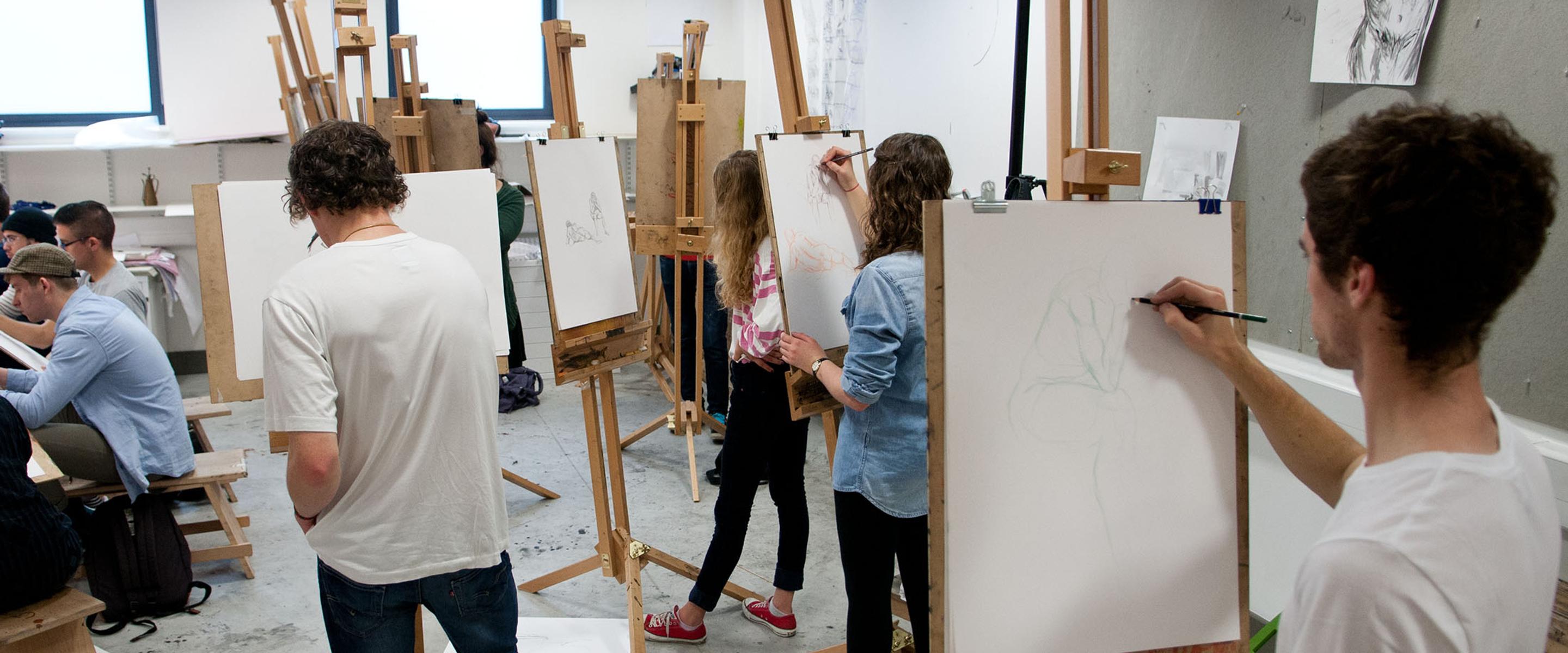 group of students painting at easels