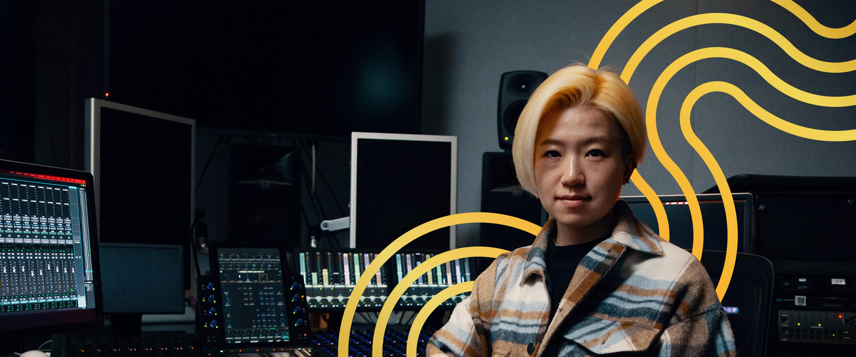 Media student posing in a multimedia studio.