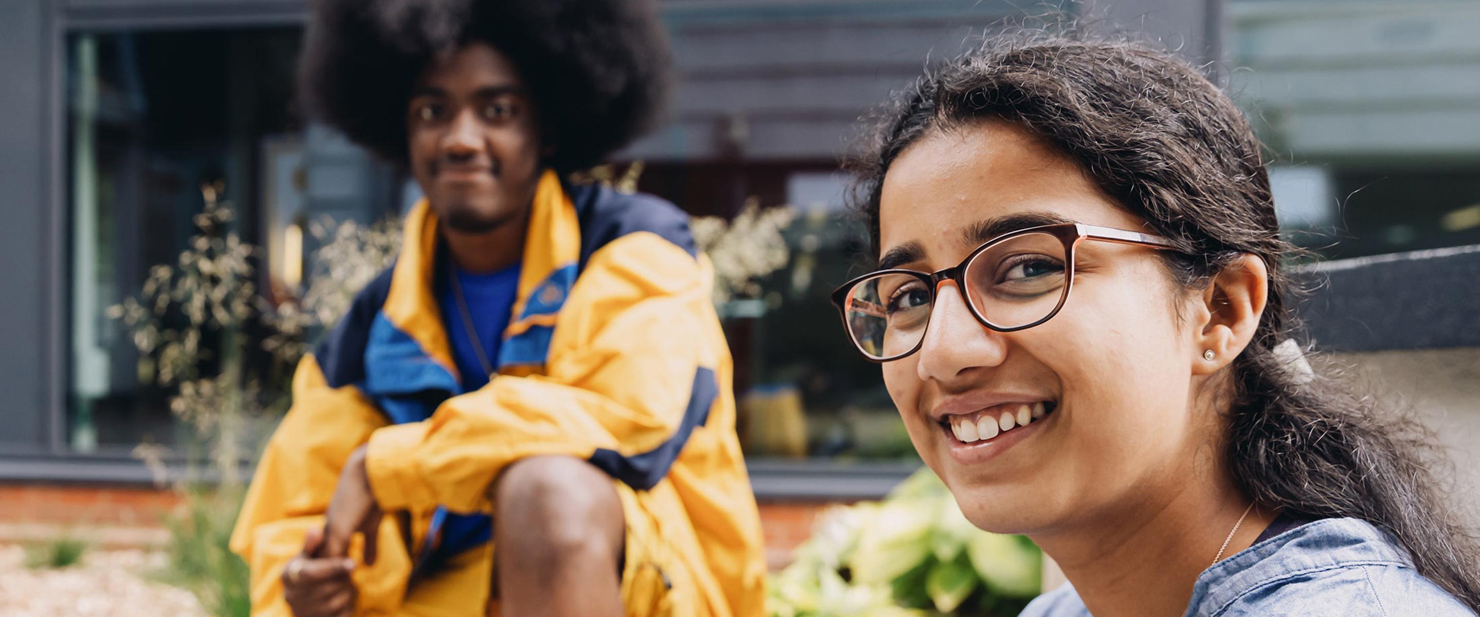 Two students sat on campus