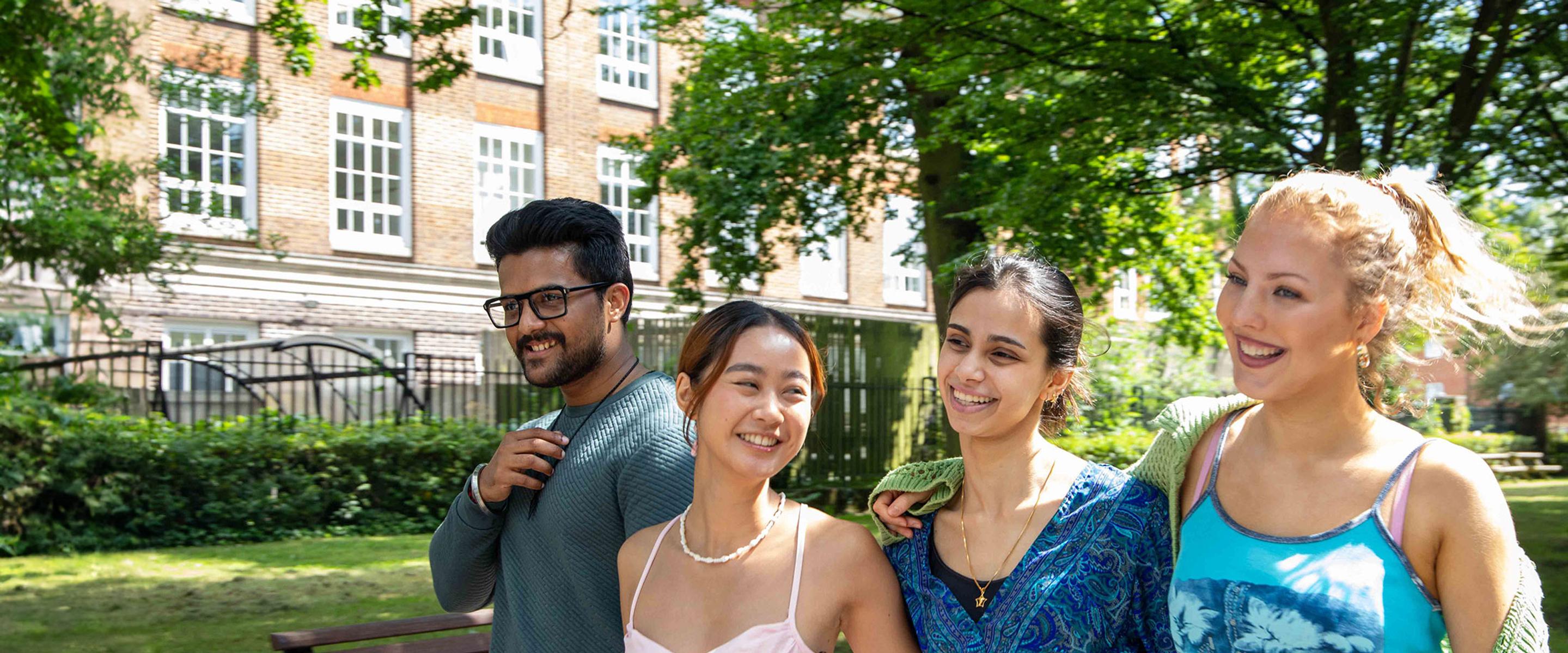 Group of student walking through campus