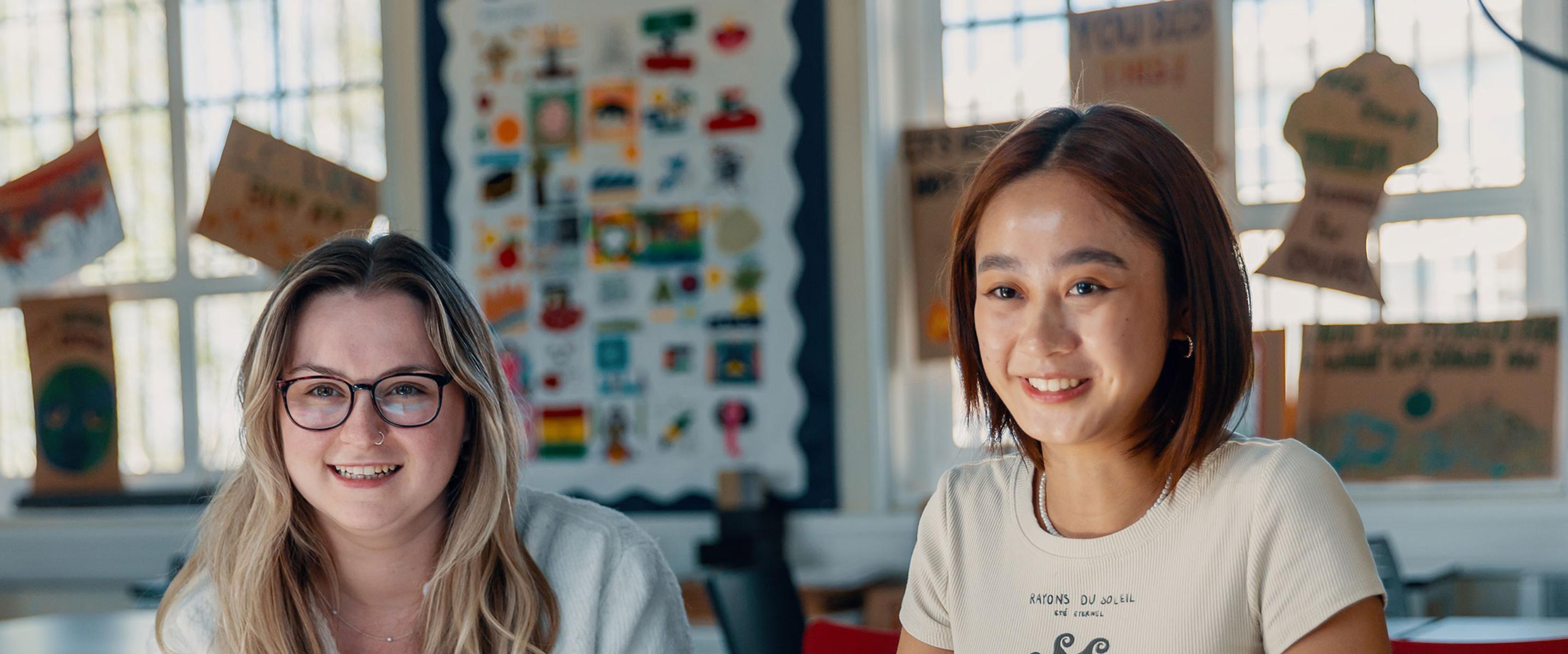 Two students on campus in class