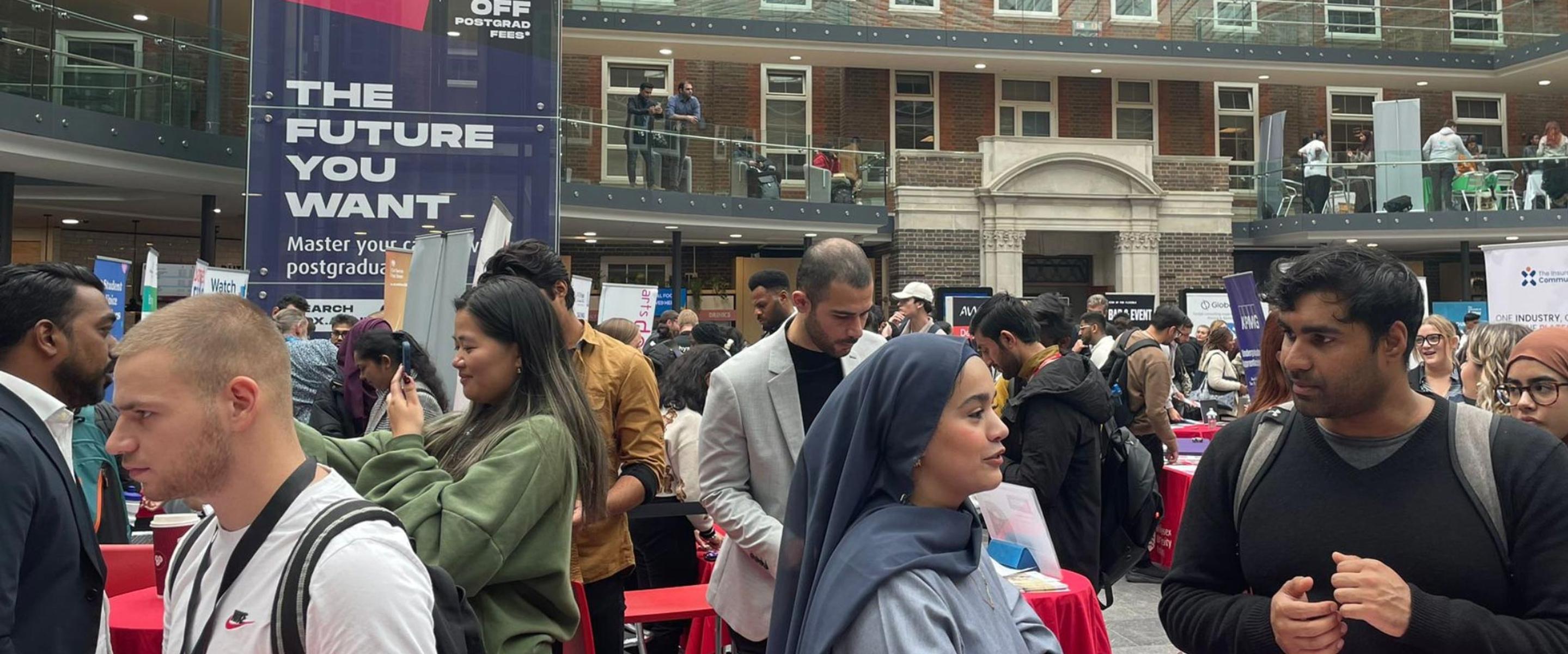 Lots of people in a building at a careers event