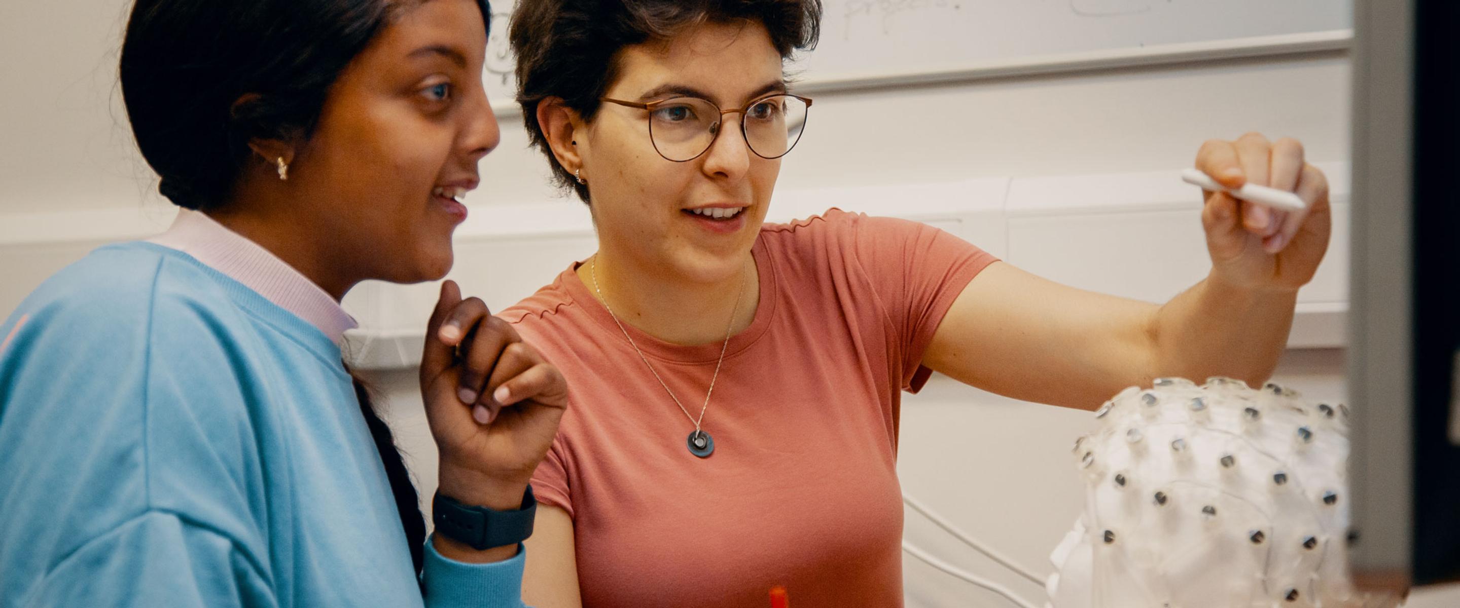 Two neuroscience students looking at screen.