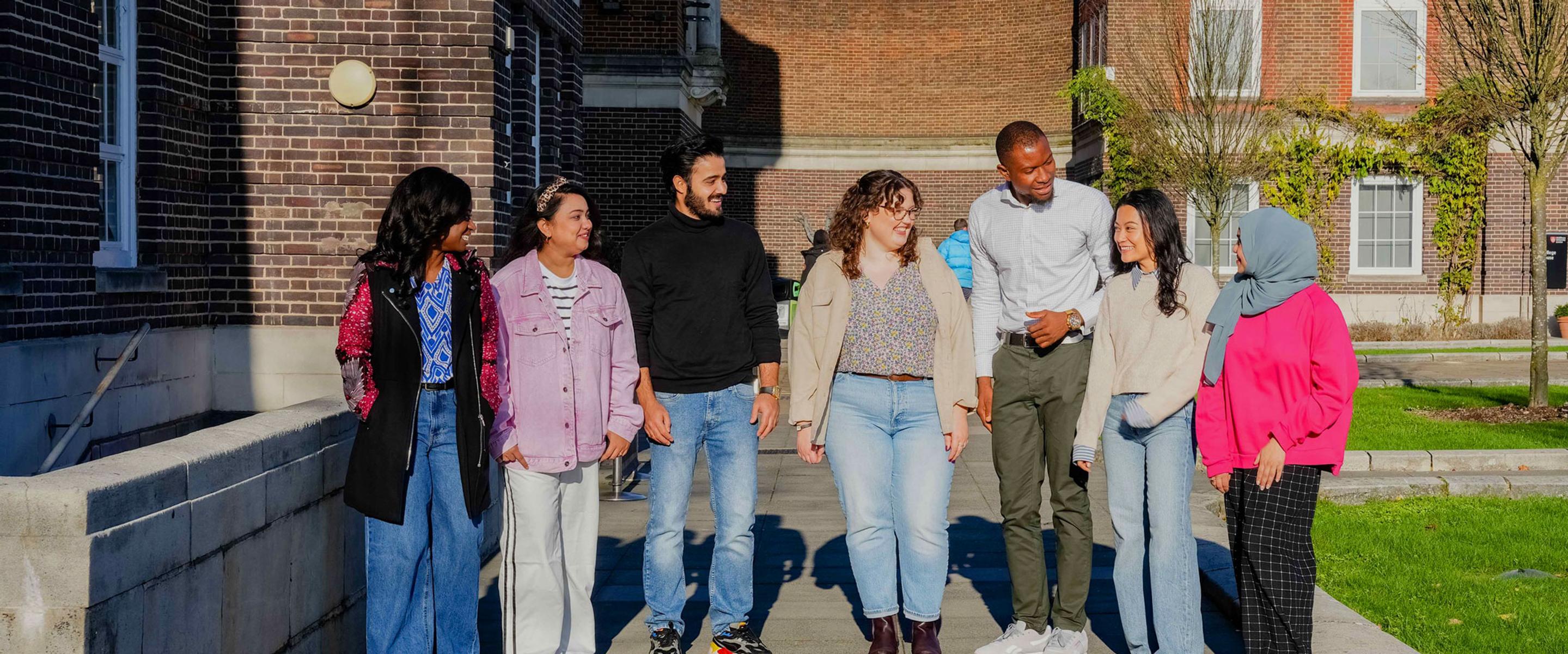 Group of students in front of a red brick building