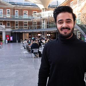 Male student in the quad building at Middlesex University