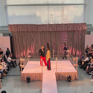Fashion students on stage at degree show