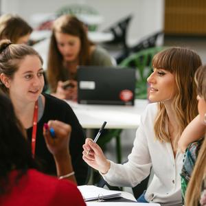 Staff and students chatting