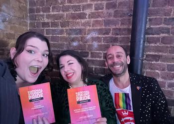 three people at awards ceremony