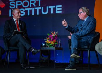 Two people on a stage at an event