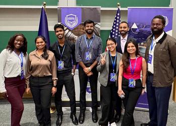 Students stand together for photo after conference