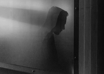 A projection of a person on a wall