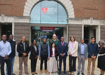 People stand outside a university building